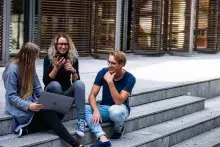 Three-persons-sitting-on-the-stairs-talking-with-each-other - photo by Buro Milennial from pexels